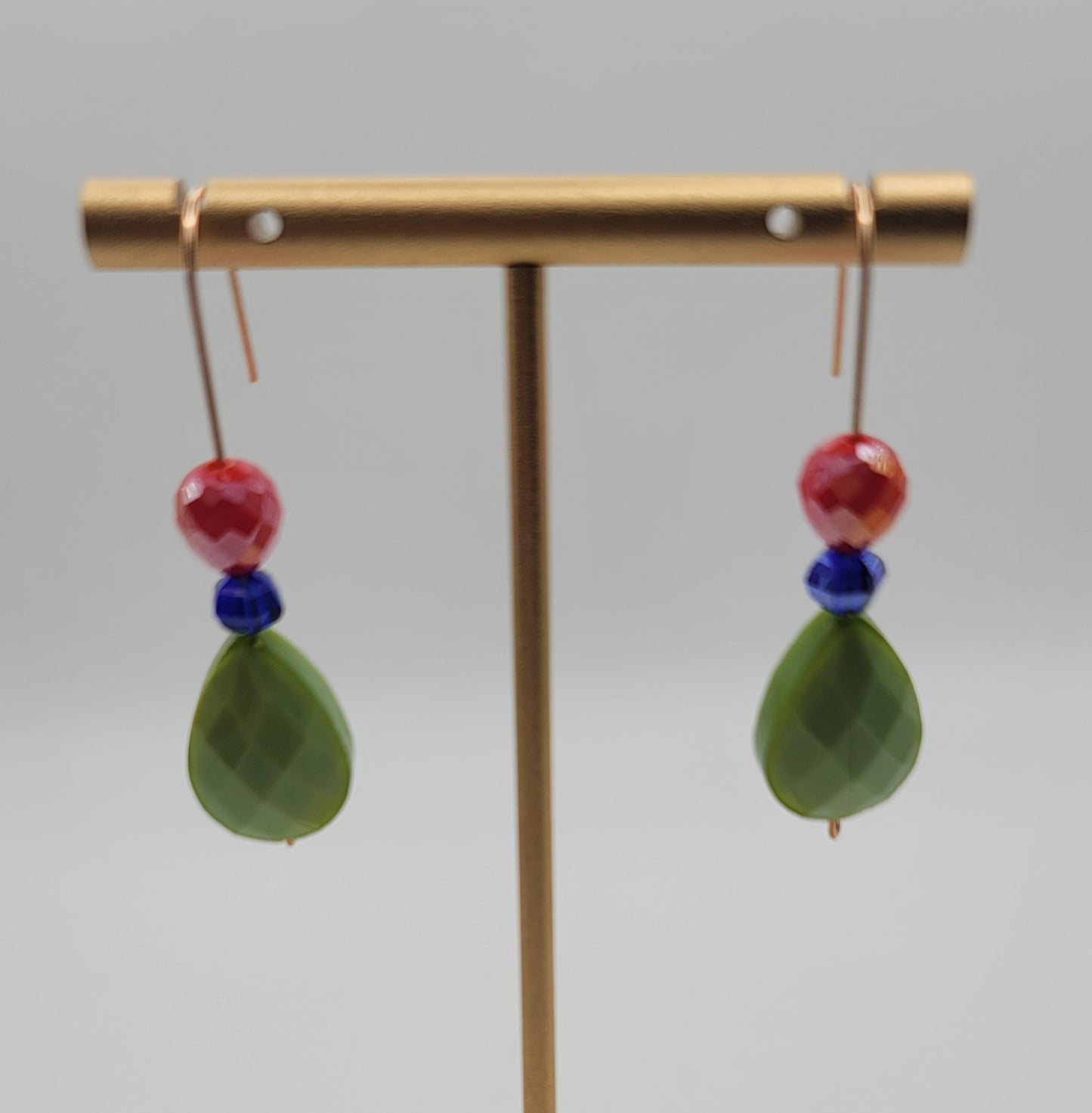 Red, blue, and green earrings